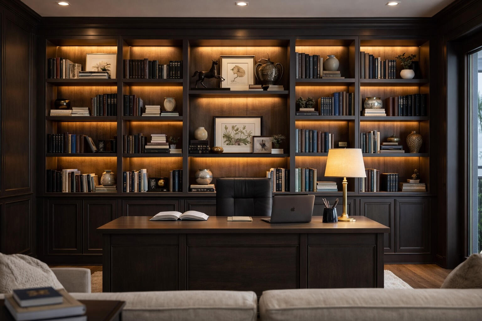 Custom home office built-in cabinets with dark wood shelving and LED lighting in Sarasota area